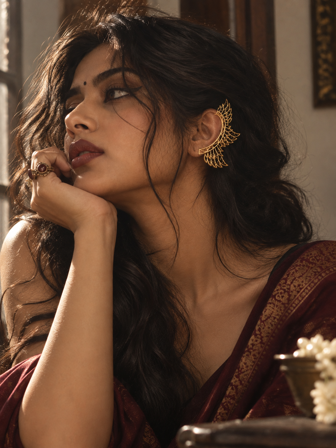 Model wearing a brass ear cuff