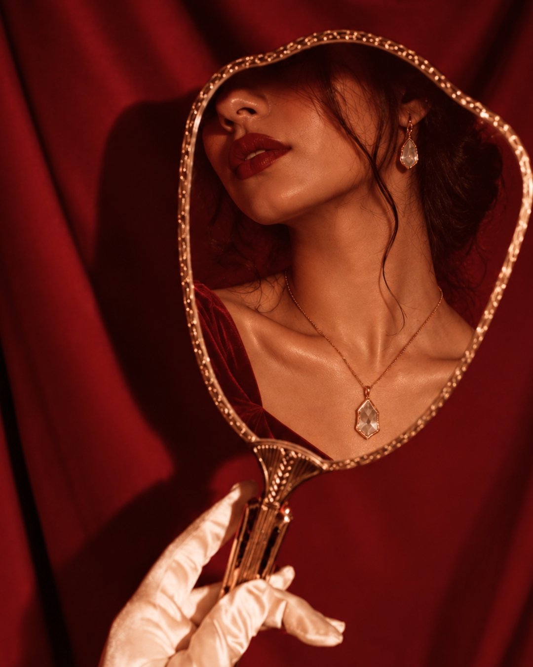 Pendant necklace reflected in a mirror